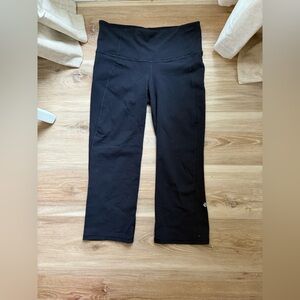 Lulu Lemon capri leggings. Black with a cute little slit on the end. Gently worn